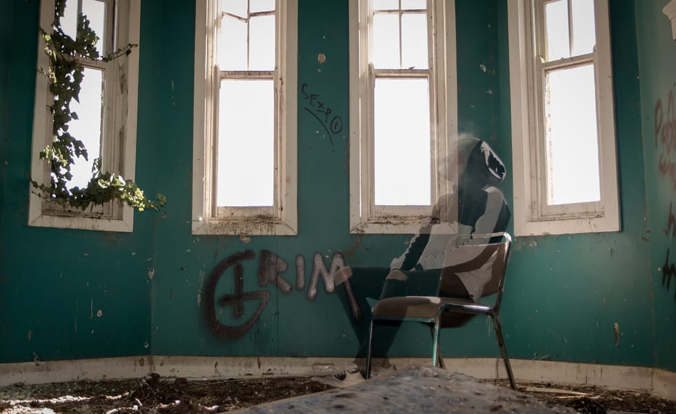 Ghost sitting on chair in empty room. Photograph by kind permission of Corey McAloon. Instagram: coreymcaloon